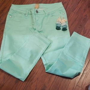 Mint color jeans with earrings